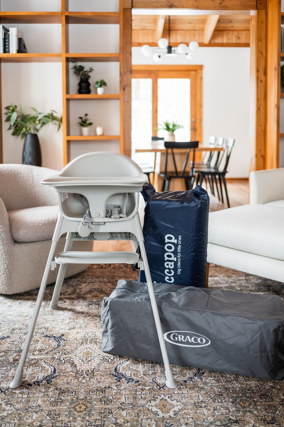High chair and portable travel crib provided for families with young children
